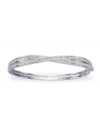 A twist on classic style, from Swarovski. Add some shimmer to your wrist with this Edith bangle bracelet featuring sparkly crystal accents. Crafted in rhodium-plated mixed metal. Approximate diameter: 3-1/4 inches.