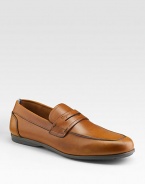 Smooth leather style crafted in Italy with penny loafer detail. Leather lining Padded insole Rubber sole Made in Italy 