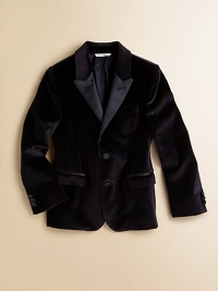 A supremely tailored jacket in plush velvet with satin lapels and flap pockets in a classic, single-breasted silhouette.Notched lapelLong sleeves with detailed button cuffsSingle-breasted button-frontWaist flap pocketsFully linedCotton/Polyester/SilkDry cleanImported Please note: Number of buttons may vary depending on size ordered. 