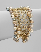 A chain link design embellished with multi-colored glass pearls. BrassGlass pearlsLength, about 7½Magnetic clasp closureImported 