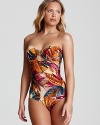 Tropical leaves overtake this strapless OndadeMar one-piece swimsuit, rendered in warm hues and a classic, flattering silhouette.