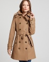 An essential style, this Burberry Brit coat outfits the timeless trench silhouette with a decadently thick fabrication for impeccable cold-weather polish.