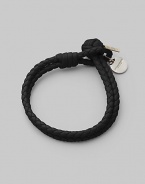 Fine leather, artfully woven into a rope design that wraps the wrist with rich character. Available in Small and Medium. Woven leather Medallion detail Small length, about 7½ Medium length, about 9 Knot and loop closure Made in Italy