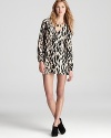 Bring a touch of animal magnetism to your workday look with this boldly printed Parker wrap dress.