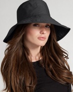 Floppy, water-resistant coated cotton is stylish for rainy days. Signature logo detail Brim, about 4¼ wide One size fits most Cotton; spot clean Imported