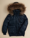 Brave the cold in this down puffer with luxe features including a fur-trimmed hood and leather details.