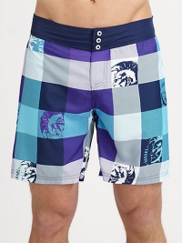 Bold, colorful plaid swim trunks with graphic detail in quick-drying nylon.Elastic waistBack flap pocketInseam, about 7PolyesterMachine washImported