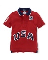 A breathable cotton mesh polo is accented with bold country embroidery, celebrating Team USA's participation in the 2012 Olympics.