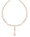 Sweet pink imitation pearls and a dangling strand make this Charter Club strand necklace a darling addition for your seasonal look. Crafted in gold tone mixed metal. Approximate length: 16-1/2 inches + 1-1/2-inch extender. Approximate drop: 1-1/2 inches.