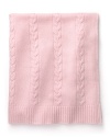 A soft pink cable cashmere blanket by Aqua, wraps baby in sumptuous warmth.