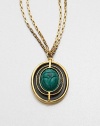 A malachite scarab pendant accented with lizard skin on a double box link chain. MalachiteLizard skinGoldtone brassLength, about 36Pendant size, about 1Lobster clasp closureMade in USA