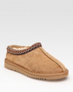 Stay cozy in a this classic suede style with plush shearling lining and embroidered details. Stretch suede upper Shearling lining Foam sole Padded insole Imported