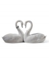 Exquisitely crafted of porcelain, the Endless Love figurine by Lladro presents a pair of snowy swans united in love. Designed as a wedding cake topper, or a bridal or anniversary gift, this heirloom quality collectible will be cherished for generations to come. 5.25 x 10.5.