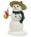 With a bird nested in his hat and a ball of seeds for the taking, this generous snowman takes care of all the Christmas cardinals. Pristine snow glitters beneath a green scarf from Byers' Choice.