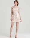 Allover petals lend dimension to this ultra-feminine Aidan Mattox dress, finished with a satiny ribbon belt.