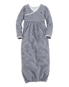 An adorable long-sleeved gown is rendered in soft, striped cotton jersey.