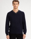 A smart v-neck sweater updated with ribbed detailing and standout contrast trim.V-neck with contrast ribbed trimLong sleeves with ribbed cuffsRibbed hemMerino woolHand wash or dry cleanImported