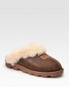 Bomber-inspired suede in a timeless design with shearling lining and a comfy foam sole. Foam heel, 1 (25mm)Suede upperShearling liningFoam solePadded insoleImported