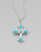 This cross of vibrant turquoise is framed in sterling silver and punctuated by luminous diamonds.Diamond, 0.15 tcw Sterling silver Pendant length, about 2½ ImportedPlease note: Chain sold separately 