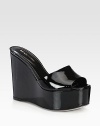 A curved wedge heightens this sleek patent leather slide. Self-covered wedge, 5 (125mm)Covered platform, 2 (50mm)Compares to a 3 heel (75mm)Patent leather upperLeather lining and solePadded insoleMade in Italy