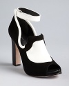 Black and white and red hot all over: these Rachel Roy platform pumps feature distinctive high-contrast oxford styling.