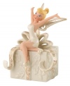 Let your imagination take flight with a hint of pixie dust. Never Land's illustrious fairy, Tinkerbell, strikes a joyful pose atop a beautifully embossed gift. In ivory porcelain with swirls of gold, this Lenox figurine makes Disney magic happen at home.