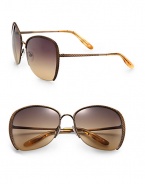 Get lost in these stylish, lightweight metal sunglasses with braided metal temples. Available in brass with brown gradient lens.Metal temples100% UV protectionMade in Italy