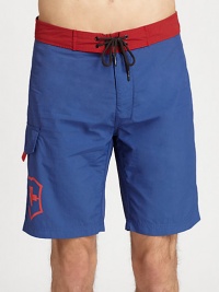 Contrasting waistband adds a splash of color to this all-time beach favorite.Drawstring tie waistSide cargo pocketInseam, about 9NylonMachine washImported