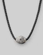 Stunning texture enlivens a gleaming silver pendant strung on braided leather. Sterling silver ¾ X 1 Necklace, about 18 Imported