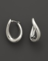 With a languid twist, a beautifully rendered hoop earring in polished 14 Kt. white gold.