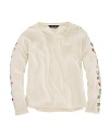 A delicate arrangement of beaded flowers adorns the sleeves of this adorable cotton jersey tee.