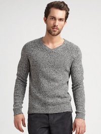 A tweed pattern and classic ribbed trim add texture to this pullover sweater.V-neckRaglan sleevesRibbed trim80% wool/20% polyamideDry cleanImported