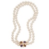 Double the elegance. Carolee's double-strand plastic pearl necklace is finished with a colorful pendant made with epoxy stones. Crafted with 12k gold-plated mixed metal. Approximate length: 18 inches.