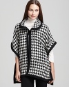 Classic houndstooth gets a contemporary twist with the loose silhouette of this Live a Little cape. Wear with essential black pants and understated boots.