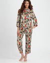 Asian-inspired pajamas look and feel like silk, yet are easily washable. Mandarin collared top Contrast button-and-loop closures Wide three-quarter sleeves with slit cuffs Side slits at hem Full length pant with drawstring waist Piped slit cuffs Polyester; machine wash Imported