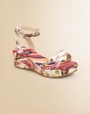 Positively brilliant, this graceful sandal combines bright butterflies and colorful stripes on a modern wedge.Polyester fabric upperCrisscross front strapsBuckle ankle strapsGoatskin leather liningStriped fabric footbedMolded fabric-covered wedgeNon-slip soleMade in Italy