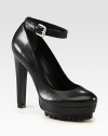 Ultra-high heel and platform carry this smooth leather pump with a rubber sole and an adjustable ankle strap. Self-covered heel, 5 (125mm)Island platform, 1½ (40mm)Compares to a 3½ heel (90mm)Leather upperLeather liningRubber solePadded insoleImported