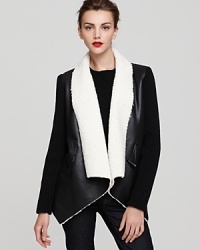 Give new direction to your capsule collection with this luxe San Edelman sherpa-lined wrap coat and exude modern edge every day.