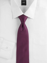 An elegant Italian silk design is finished with tiny dots allover. Silk Dry clean Made in Italy 