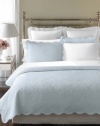 The Stenciled Leaves quilt from Martha Stewart Collection features bushels of leaves embossed over a light blue ground. Scalloped edges add a sense of elegance to this design in affordable cotton voile.