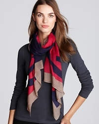 Dramatic, oversized logos add designer je ne sais quoi to this color-blocked scarf from Tory Burch.