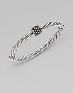 A bold cable bangle of sterling silver, with a rhodium-plated diamond rondelle as its centerpiece. Diamonds, 0.43 tcw Sterling silver and rhodium plating Cable, 6mm Diameter, about 2½ Made in USA