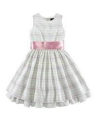 A charmingly traditional dress in multi-striped cotton seersucker has a pretty, full skirt with a petticoat and ribbon sash.