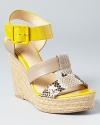 Bright sunny yellow adds high style to Calvin Klein's Ellison espadrilles--mixed with snakeskin embossed and nude leathers, it's a combination impossible to resist.