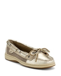 Glitzy in gold, these fabric-trimmed Sperry Top-Siders exude laid-back glamour.