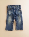 Darling denim for the little one, this distressed pair with a faded rinse is a fun take on the blues. Belt loops Front zipper with snap closure Five-pocket styling Back flap snap pockets Small Buddha pocket lining Cotton; machine wash Imported of American fabric Please note: distress pattern may vary