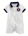 A preppy short-sleeved polo shortall in breathable stretch cotton mesh is accented with USA patching, celebrating Team USA's participation in the 2012 Olympics.