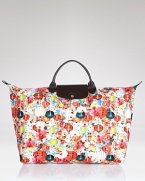 Longchamp's reliable French design goes graphic with this bright tote. Shoulder the color-splashed carryall for a practical pick-me-up--it's sized just right for all your essentials.