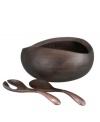 Crafted of alloy and finished in beautiful bronze, the Heritage Pebble Oval salad bowl from Nambe's collection of serveware and serving dishes combines old-world elegance with a chic, modern shape.