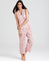 The beauty of Moroccan tile design is translated on to this stylish pajama set with a sleeves top and cropped pants.